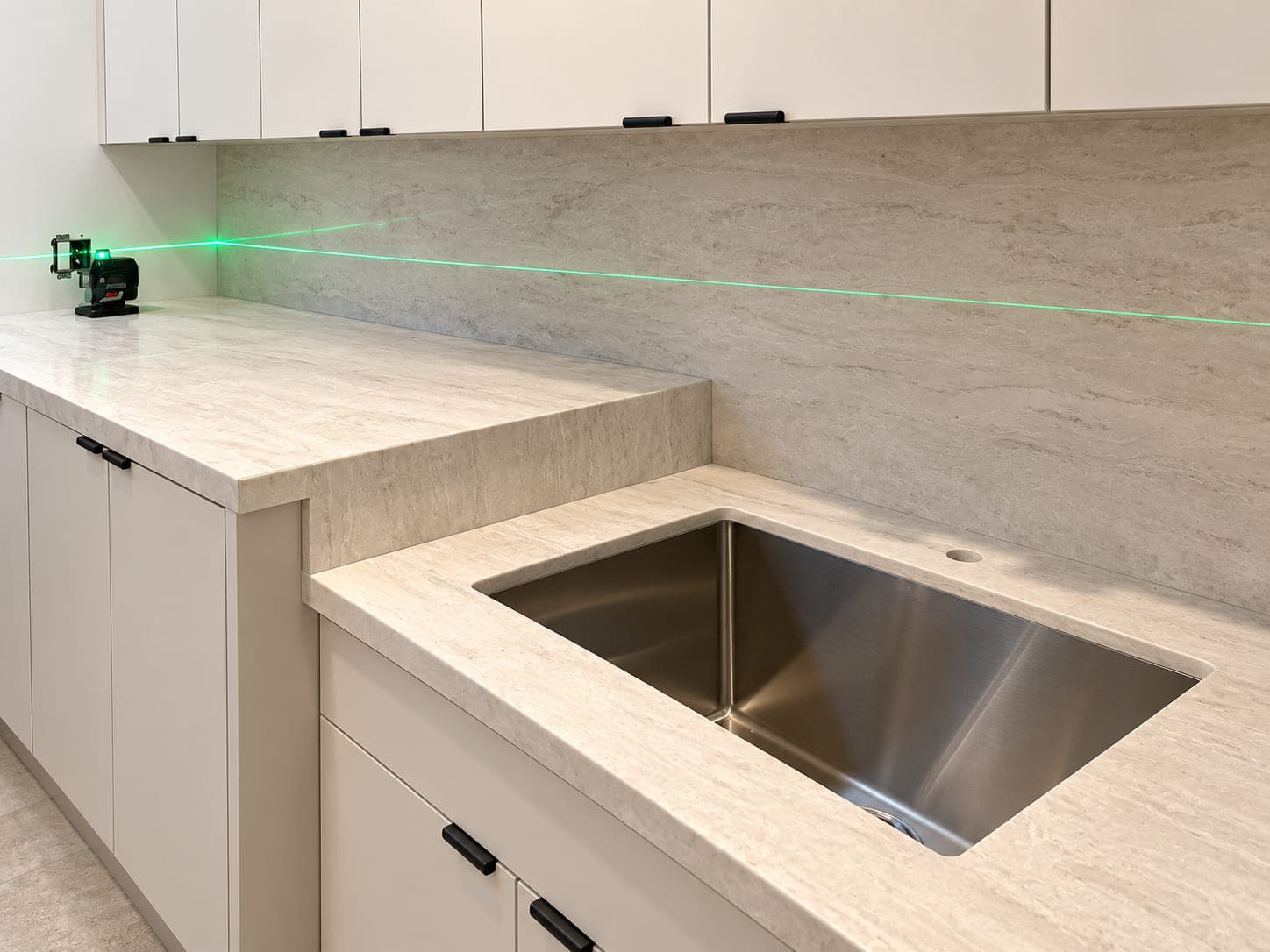 5-axis CNC machine cutting a marble countertop
